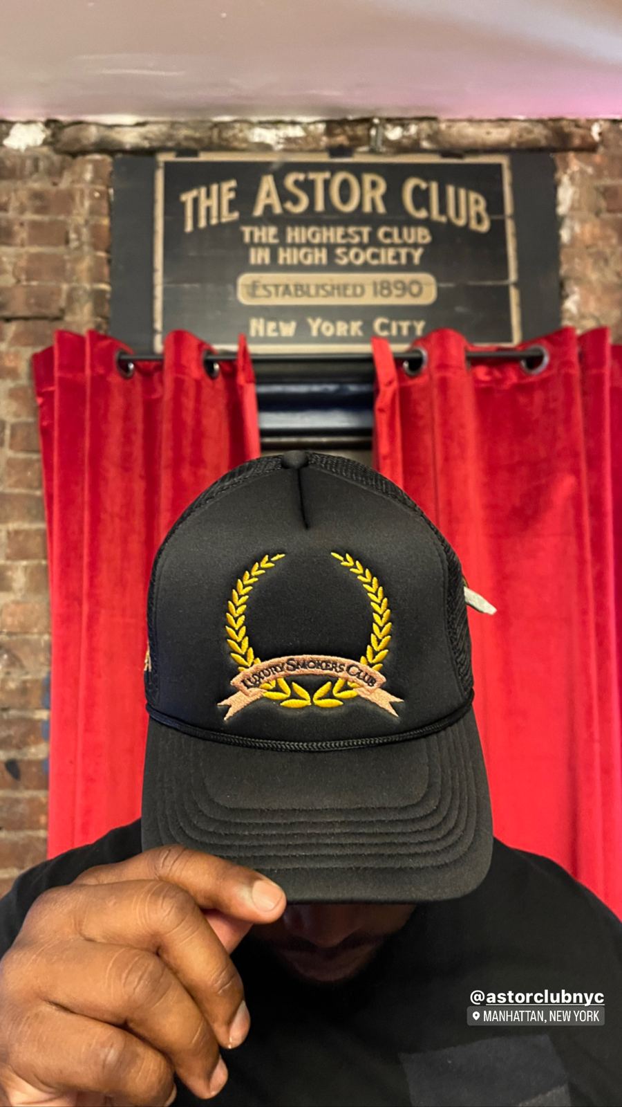 LSC wreath trucker hat at The Astor Club